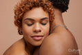 Studio portrait of hugging couple