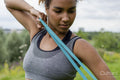 Woman exercising with resistance band