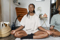 couple practicing yoga at home