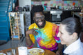 People laughing during meal at home