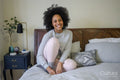 Young woman relaxing on bed