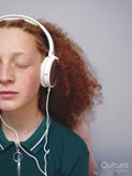 Girl listening to music on headphones