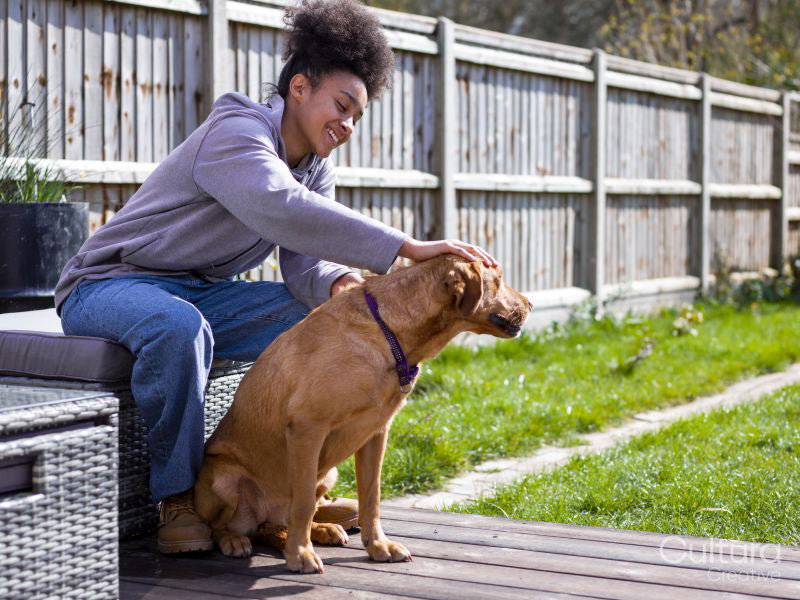 Girl with dog in backyard