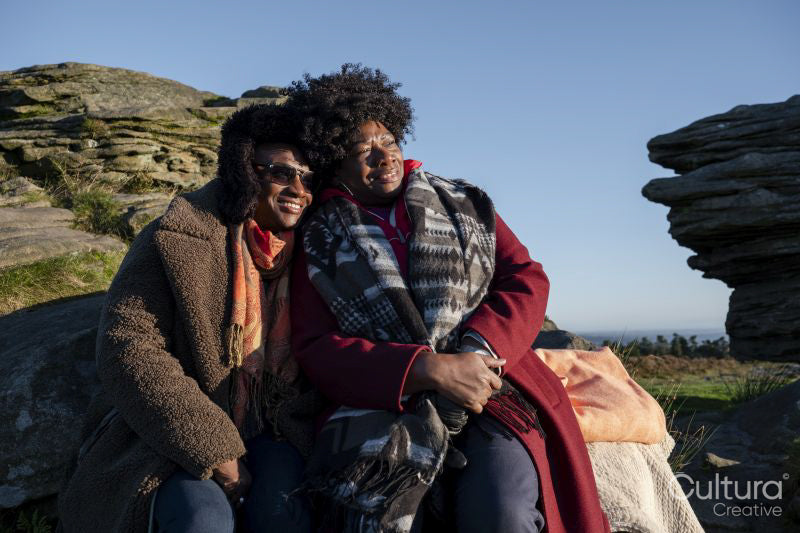 Two senior women relaxing in nature