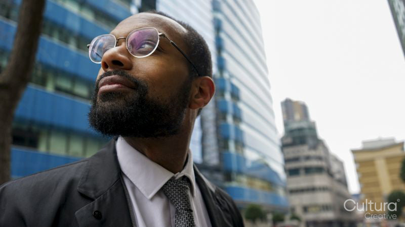 Business man looking at office building
