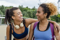 Smiling female friends embracing