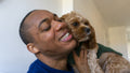 Man hugging dog