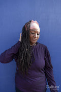 Portrait of beautiful woman with dreadlocks wearing a headscarf