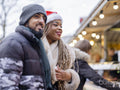Smiling young couple at Christmas market