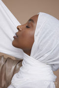 Studio shot of young woman in white hijab