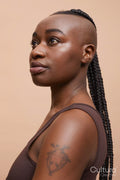 Portrait of beautiful woman with mohawk hair