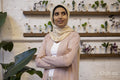 Portrait of woman wearing headscarf in flower shop
