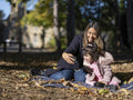 Mother and daughter with Down syndrome taking selfie in park