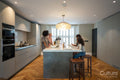 Family enjoying dinner in kitchen