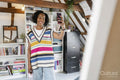 Smiling woman taking selfie in attic