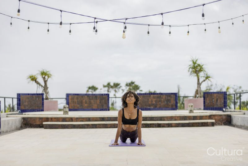Woman practicing upward facing dog pose