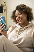 Smiling woman having video call at home