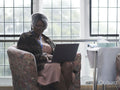 Therapist using laptop in office