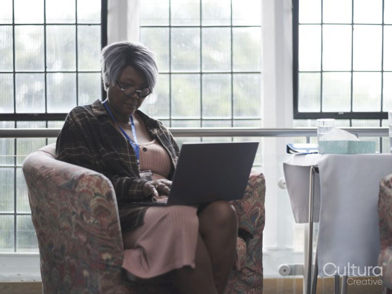 Therapist using laptop in office