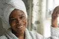 Portrait of smiling woman in towel on head
