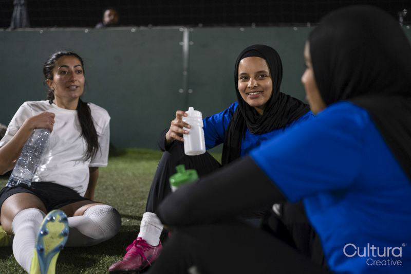 Female soccer players resting