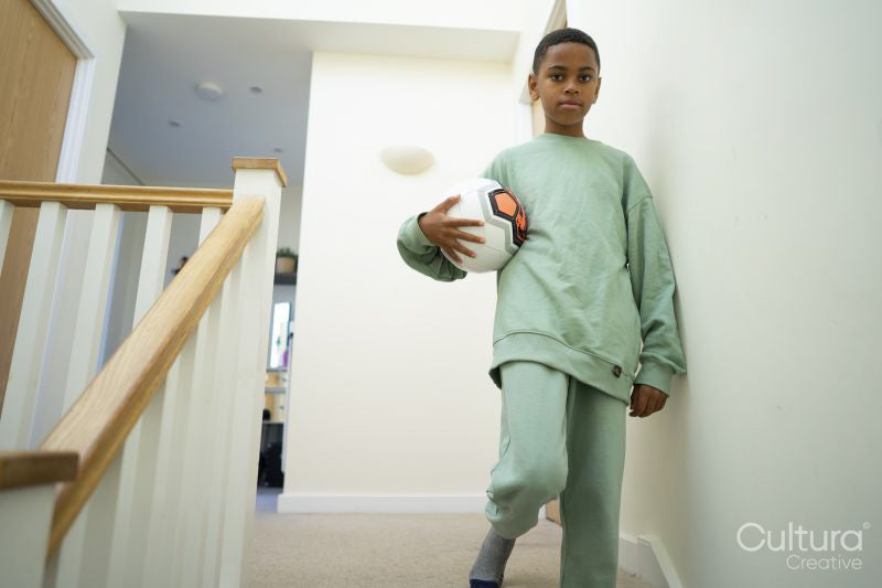 Portrait of boy holding soccer ball