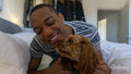 Man lying in bed with dog