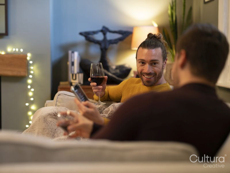 couple relaxing on sofa at home