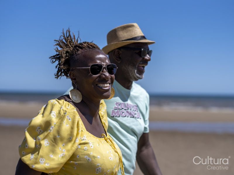 Mature couple walking on beach