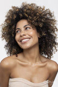 Smiling brunette woman wearing strapless top