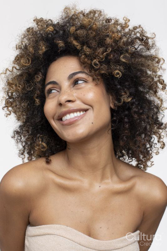 Smiling brunette woman wearing strapless top