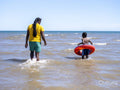 Father and son playing in sea