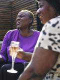 Two women relaxing in backyard