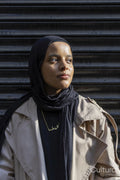 Portrait of young woman wearing hijab