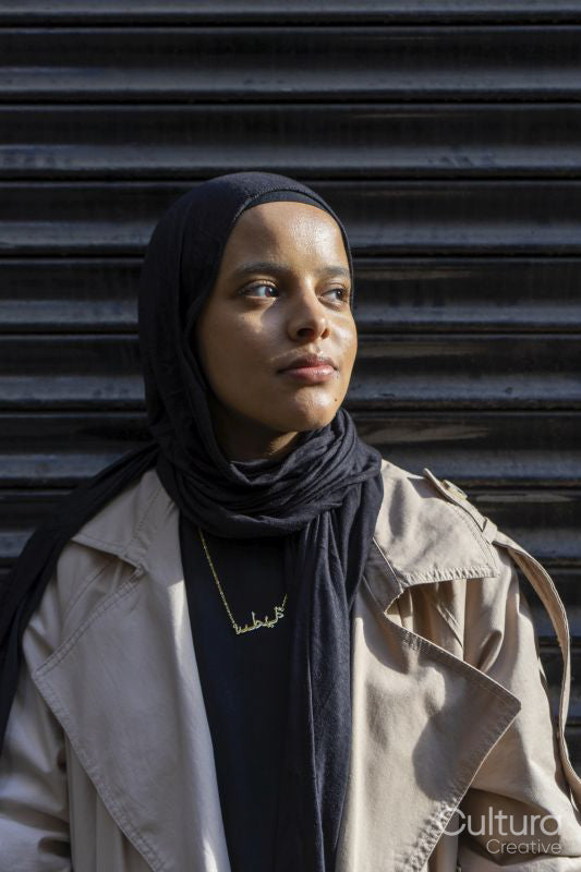 Portrait of young woman wearing hijab