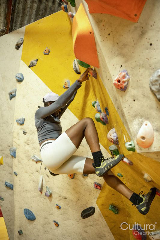 Woman on climbing wall