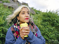 Woman holding cup with hot drink