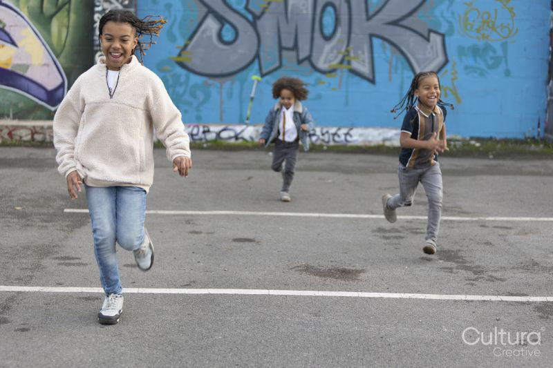 Brothers running on parking lot