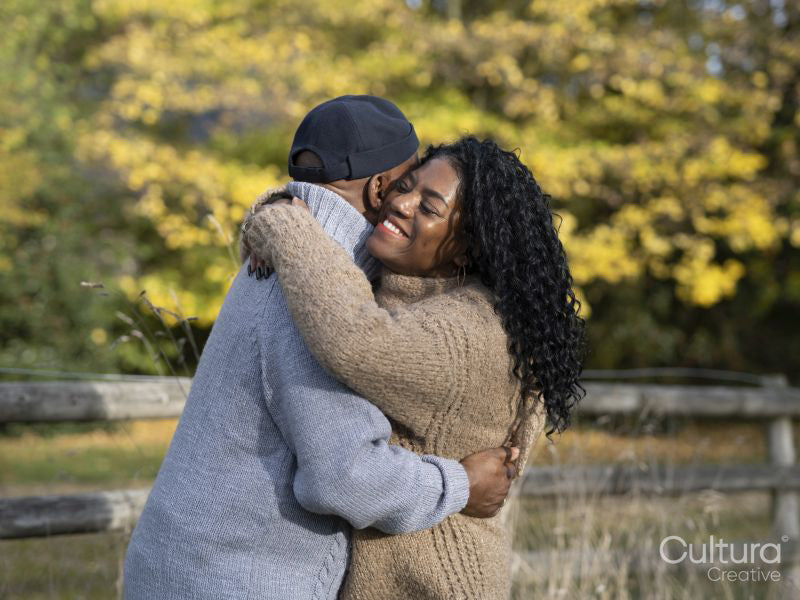 Portrait of couple embracing in nature