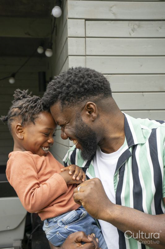 Father and daughter smiling