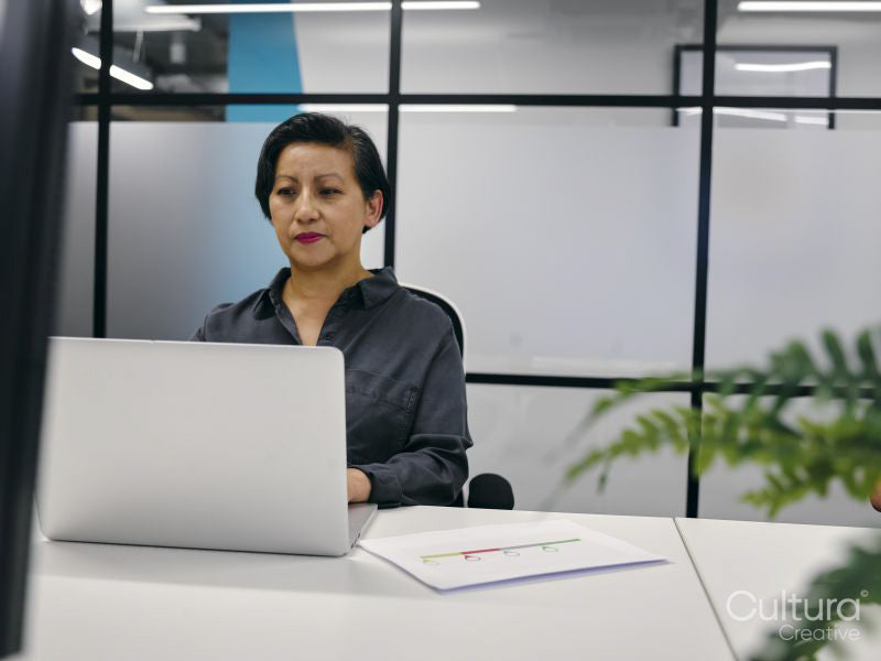 Woman using laptop in office