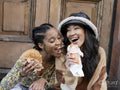 Two young women eating fast food