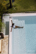 Woman relaxing in swimming pool