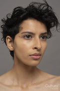 Studio portrait of shirtless woman