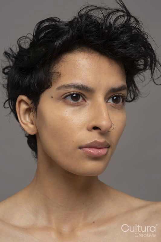 Studio portrait of shirtless woman