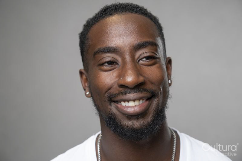 Portrait of pierced man smiling