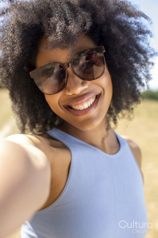 Portrait of young woman wearing sunglasses
