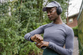 Athletic woman looking at smart watch outdoors