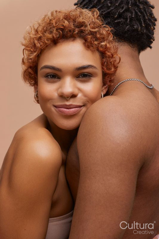 Studio portrait of hugging couple