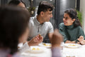 Family dining at home in evening